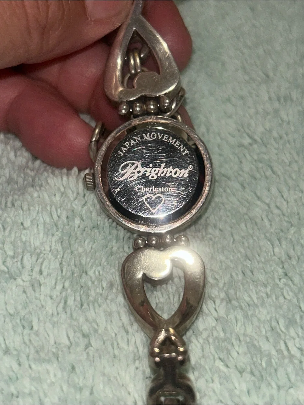 two-tone Brighton Charleston Watch featuring a round white face. RETIRED